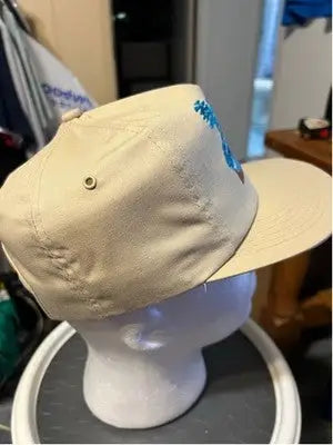 Tan men’s America’s Legend baseball cap with blue embroidered design for stylish look