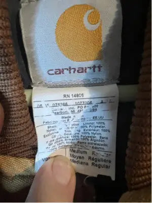 Carhartt vest label showing size, material, and care info for Men’s Carhartt Vest Size M Brown