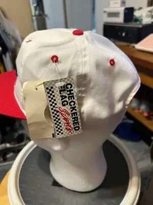 White baseball cap with red brim and buttons, checkered flag sports Daytona 500 hat