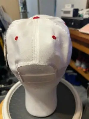 White baseball cap with red eyelets and button from Men’s CHECKERED FLAG Sports Daytona 500 1997 Hat