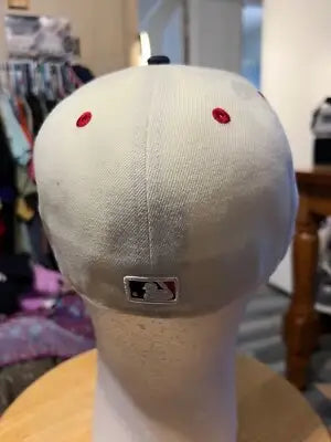 White baseball cap with red eyelets and black and red MLB logo, perfect for Pittsburgh Pirates fitted fans