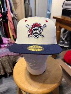 Pittsburgh Pirates fitted hat with cream crown navy brim and embroidered pirate logo
