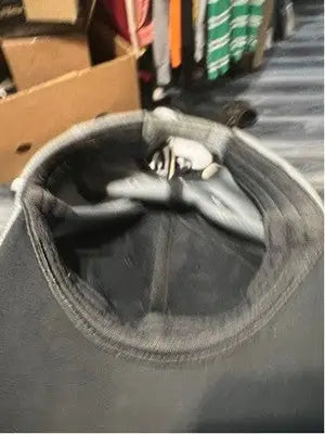 Black Nike Golf fitted hat with a worn sweatband and Nike Swoosh logo