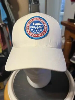 White Men’s Pelagic Hat with embroidered marlin fishing patch and branding