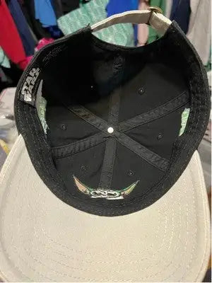 Star Wars baseball hat with black crown and light brim featuring Grogu Yoda Master Builder