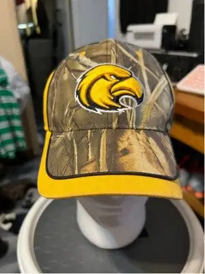 Camo print baseball cap with yellow brim and embroidered Golden Eagles eagle logo