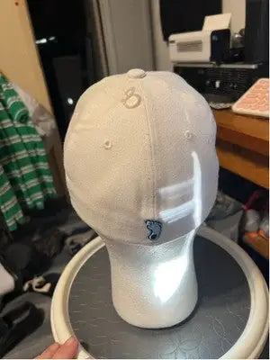 White men’s Zephyr UNC Tar Heels hat with a subtle light blue logo on the back