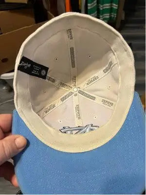 Light blue and white men’s Zephyr UNC Tar Heels baseball cap with blue brim