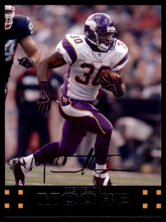 Football player in action featuring Mewelde Moore from the 2007 Topps Minnesota Vikings