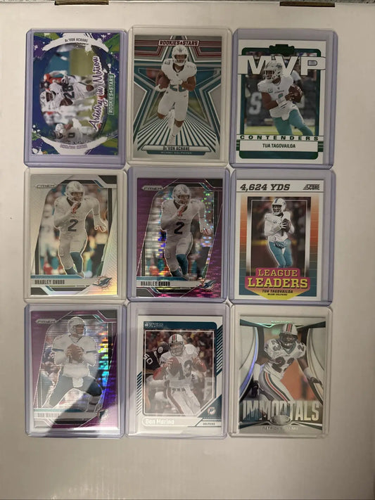 Miami Dolphins card lot featuring nine football trading cards in clear protective holders