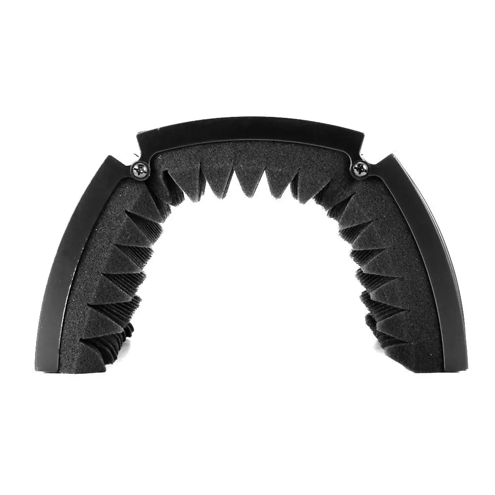 Black curved guitar capo with sawtooth rubber grip for microphone isolation shield use