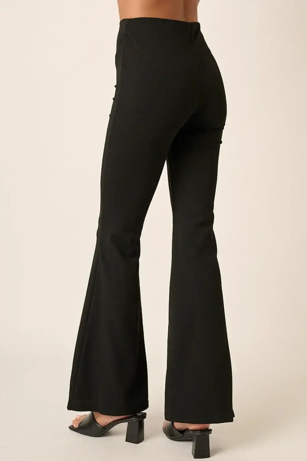Black crepe knit flare leg pants with high waist and pockets from Mittoshop