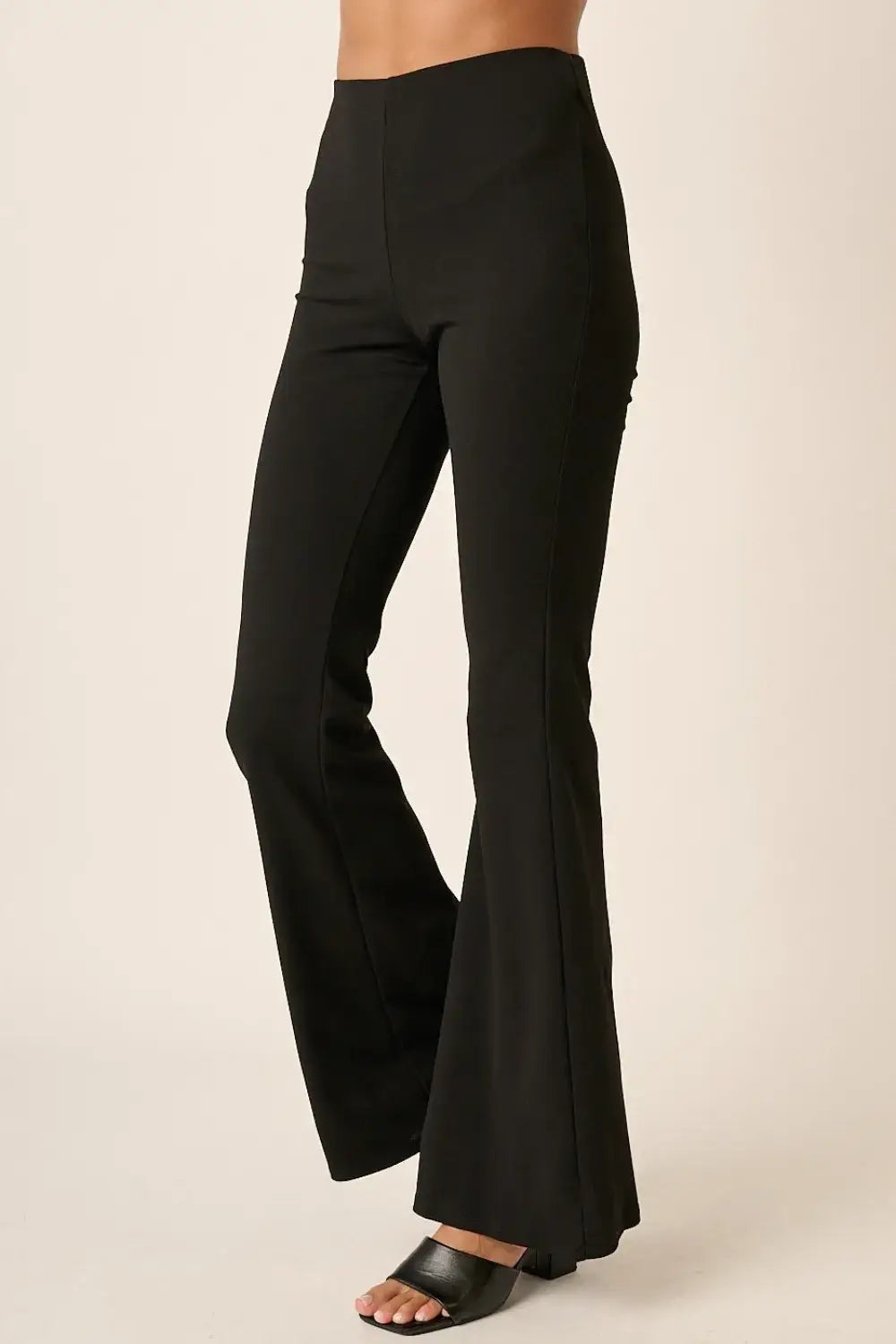 Black crepe knit flare leg pants with high waist and side pockets from Mittoshop