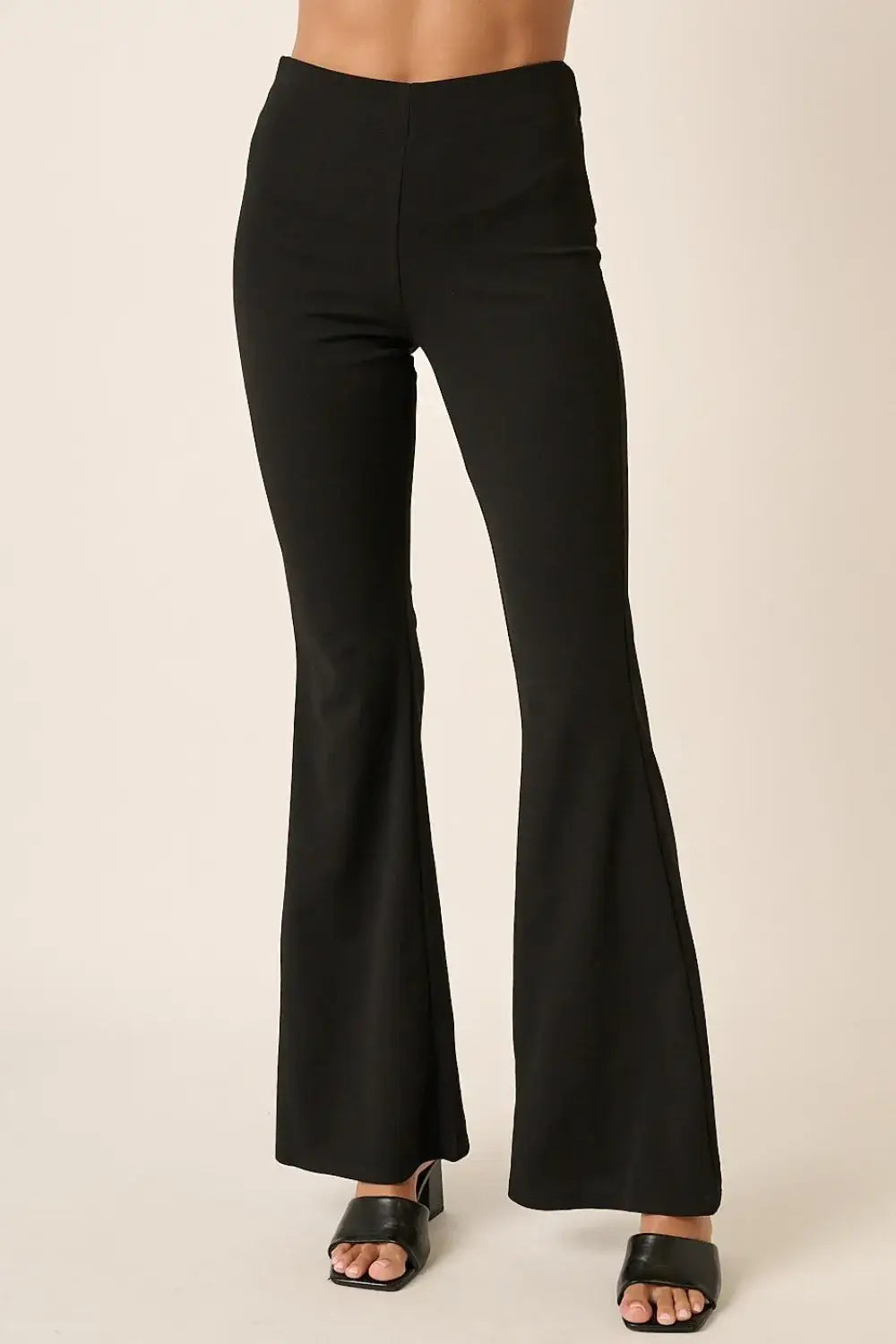 Black crepe knit flare leg pants with high waist and wide leg design for casual or semi-formal wear
