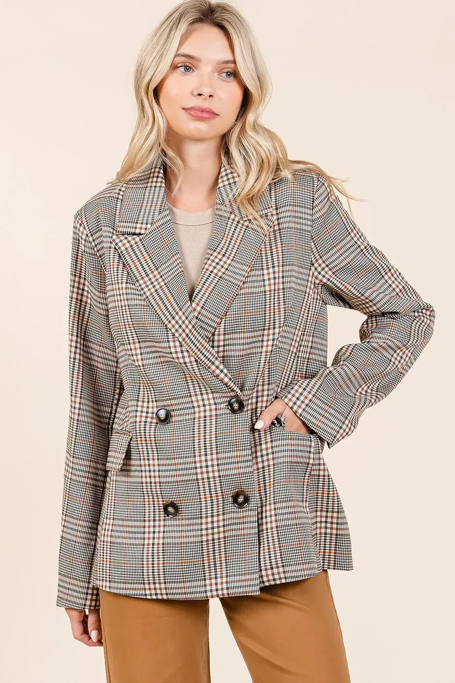 Plaid double-breasted relaxed fit blazer with black and white checkered pattern and brown buttons