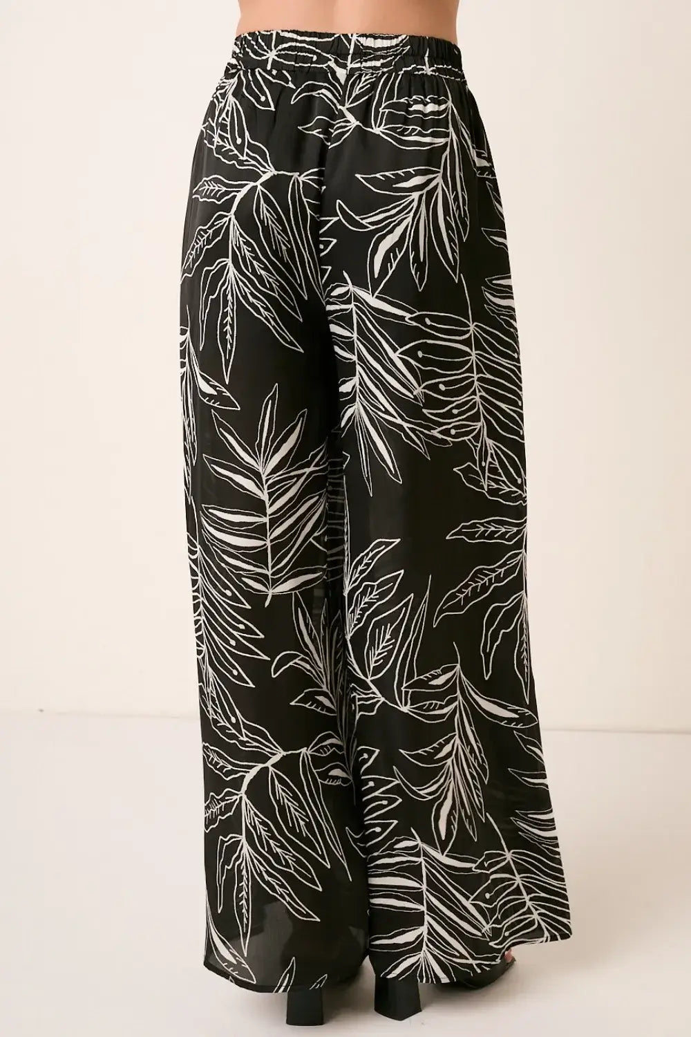 Black printed wide leg pants with white leaf design from Mittoshop Printed Wide Leg Pants