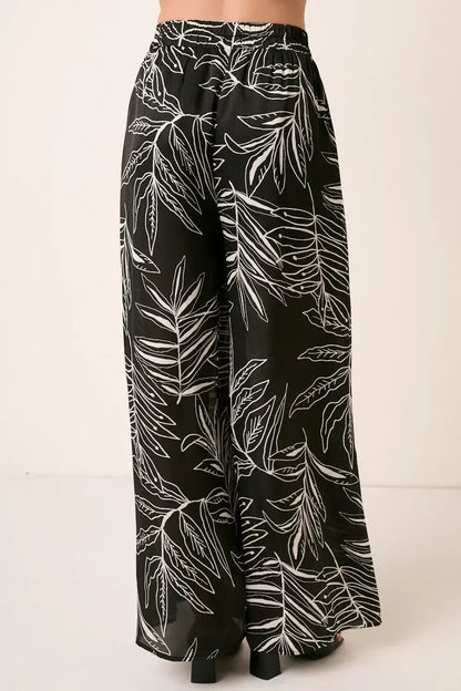 Black printed wide leg pants with white leaf design from Mittoshop Printed Wide Leg Pants