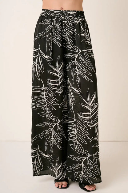 Black printed wide leg pants with tropical leaf design from Mittoshop