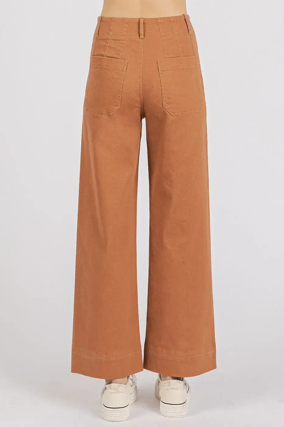 Brown wide leg pants with pockets and white sneakers from Mittoshop Twill collection