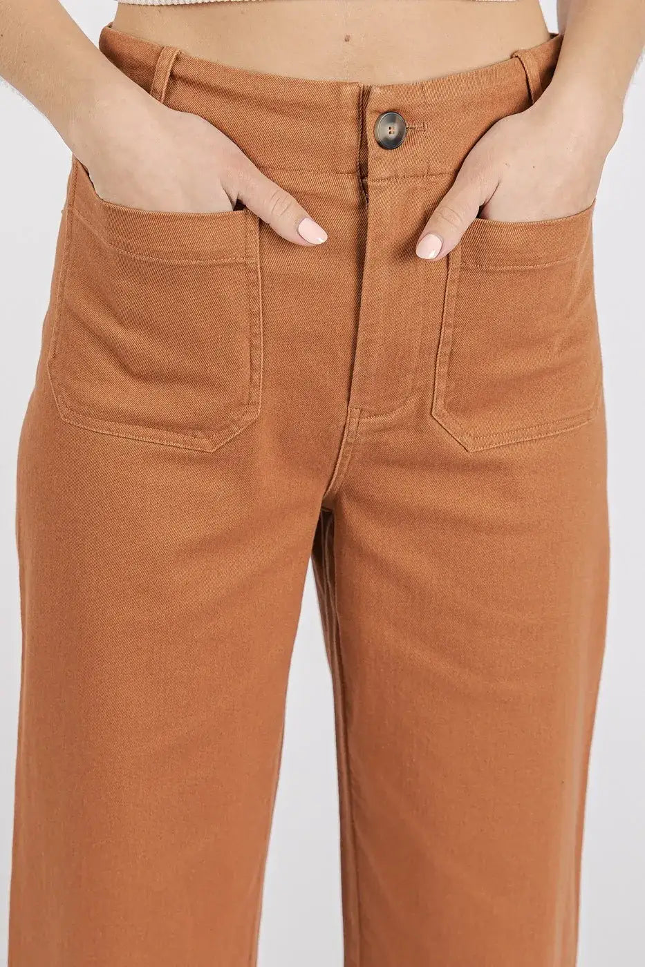 Caramel-colored high-waisted wide leg pants with button closure and patch pockets