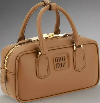 Tan leather Miu Miu Arcadie handbag with gold hardware for luxury women’s fashion