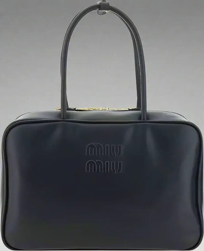 Dark blue glossy leather Miu Miu Beau handbag with double-slider zipper closure