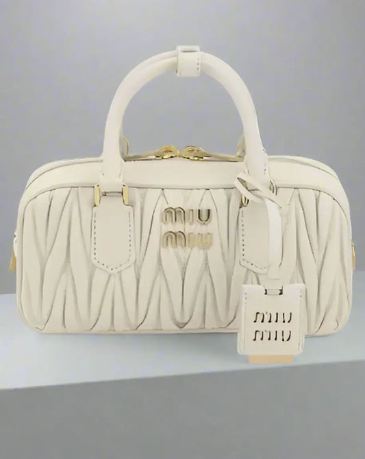 Cream-colored Miu Miu white leather MATELASSÉ handbag with gold hardware