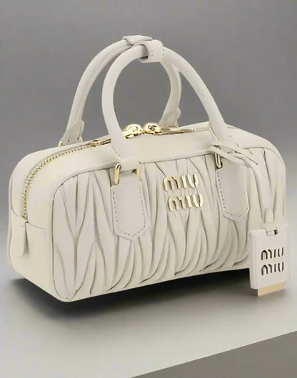 Miu Miu White Leather MATELASSÉ HANDBAG with gold hardware, stylish pleated top-handle satchel