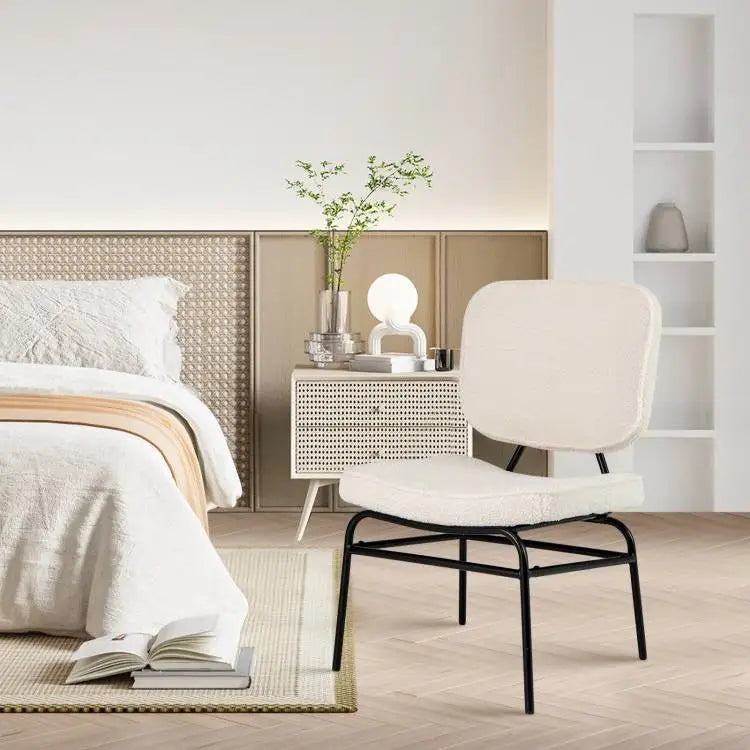 Modern beige upholstered accent chair with white leather and black metal frame