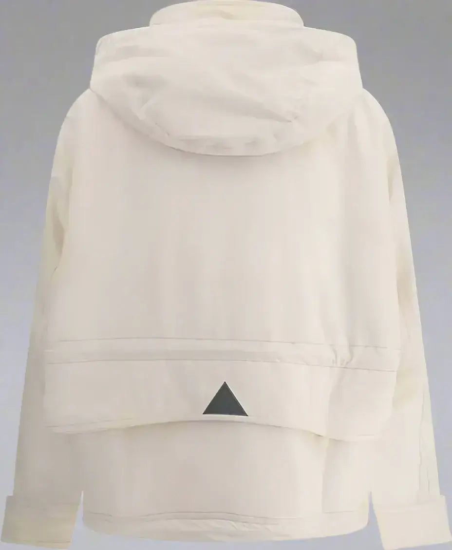 Cream-colored hooded parka nimba jacket with black triangular emblem on back hem