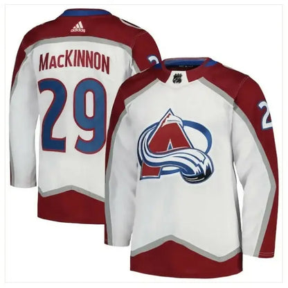 Nathan MacKinnon Colorado Avalanche away jersey displayed in white with adidas Primegreen details