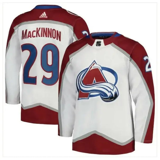 Nathan MacKinnon Colorado Avalanche away jersey displayed in white with adidas Primegreen details