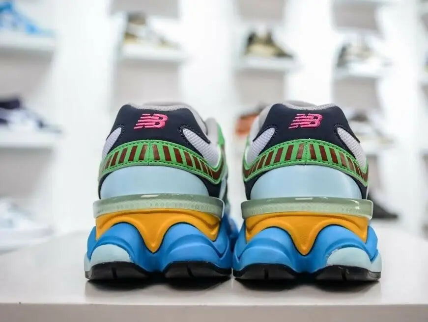 New Balance 9060 Beach Glass Pink sneakers with blue, orange, green, and black accents for fast shipping