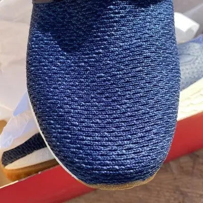 Close-up of blue knit New Balance athletic sneaker with gum sole for men size 10