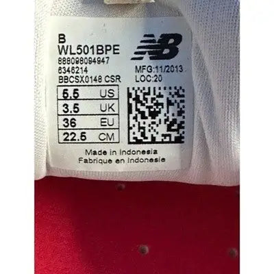 New Balance Red Low Top Sneakers Women’s Size 5.5 with detailed shoe label showing sizing and manufacturing information
