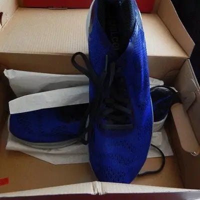 Pair of new blue New Balance sneakers in a box for men’s size 10 athletic running shoes