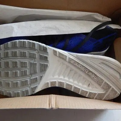 Blue New Balance running shoe in box for men’s size 10 athletic workout sneakers