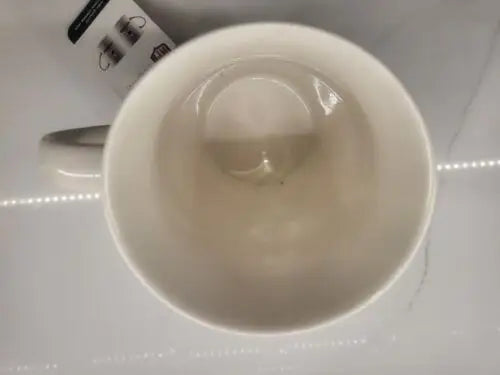 Empty white China coffee mug featuring the NEW Dallas Cowboys Classic logo design