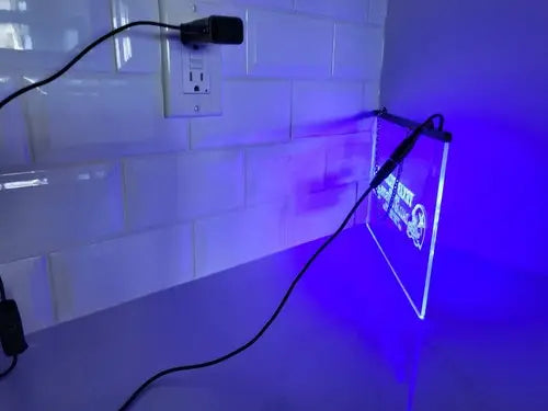 Illuminated Dallas Cowboys etched glass LED sign with black frame for Champions display