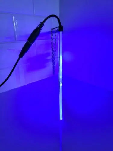 Illuminated blue light tube on Dallas Cowboys etched glass LED sign