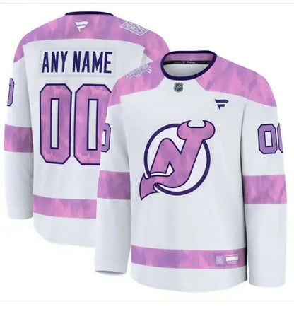 White and pink New Jersey Devils hockey jersey with customizable name and number for 2024