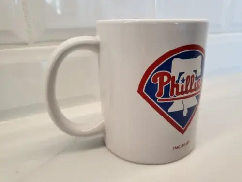 Ceramic coffee mug featuring Philadelphia Phillies White Bell logo design