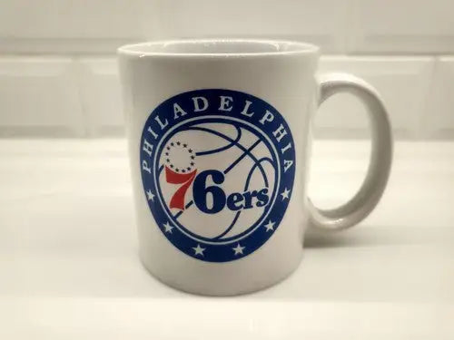 White NBA Philadelphia 76ers ceramic coffee cup featuring team logo for NBA Philadelphia fans