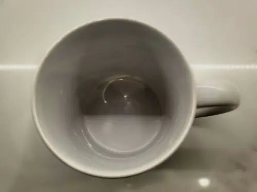 Empty white ceramic coffee cup featuring NBA Philadelphia 76ers logo for NBA Philadelphia fans