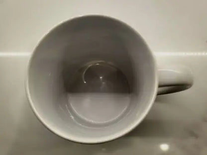 Empty white ceramic coffee cup featuring NBA Philadelphia 76ers logo for NBA Philadelphia fans