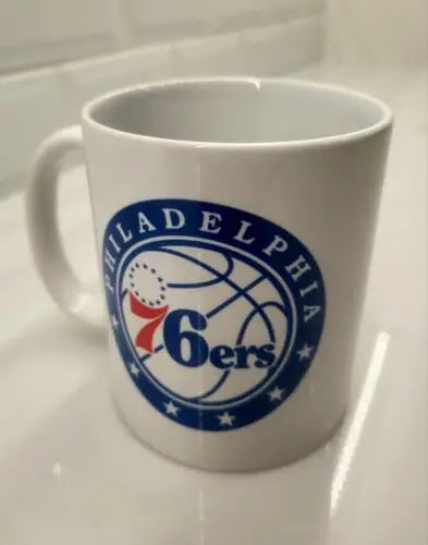 White ceramic coffee cup with nba philadelphia 76ers logo for nba philadelphia fans