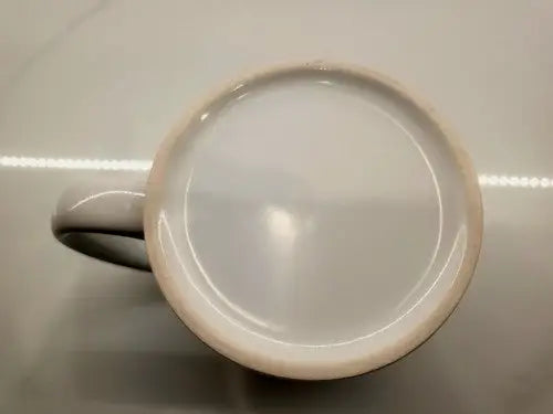 Bottom view of nba Philadelphia 76ers ceramic coffee cup featuring logo design