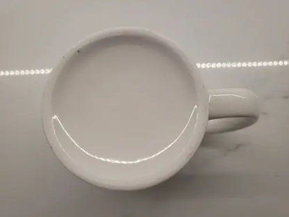 White ceramic coffee mug featuring Boise State Broncos logo for fans and collectors