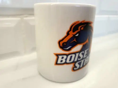 White Boise State Broncos ceramic coffee mug featuring the iconic logo