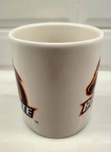 White ceramic coffee mug featuring Boise State Broncos logo for fans and collectors